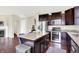 Spacious kitchen featuring dark cabinets, stainless steel appliances, and granite countertops at 14499 Milton Rd, Fishers, IN 46037