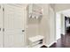 Mud room with hooks, shelving, and a bench for shoe storage at 14499 Milton Rd, Fishers, IN 46037