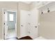 Mud room with hooks, shelving, and a bench for shoe storage at 14499 Milton Rd, Fishers, IN 46037