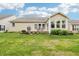 Spacious backyard featuring a deck, green lawn, mature plants, and inviting outdoor space at 1468 Blackthorne N Trl, Plainfield, IN 46168