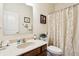 Bathroom featuring a vanity with a speckled countertop, mirror, and shower with curtain at 1468 Blackthorne N Trl, Plainfield, IN 46168