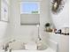 Elegant bathroom featuring a large tub, window, decor, white walls, and tile flooring at 1468 Blackthorne N Trl, Plainfield, IN 46168