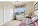 Comfortable bedroom featuring a daybed, large window view, and closet storage at 1468 Blackthorne N Trl, Plainfield, IN 46168
