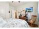 Bedroom showcasing a dresser, rocking chair, and a TV with a beach scene at 1468 Blackthorne N Trl, Plainfield, IN 46168