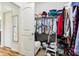 Walk-in closet featuring shelving, carpet flooring, hardwood flooring, and white walls with doors at 1468 Blackthorne N Trl, Plainfield, IN 46168