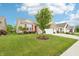 Well-maintained lawn featuring landscaping and an attached two-car garage to this lovely home at 1468 Blackthorne N Trl, Plainfield, IN 46168
