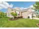 Well-manicured lawn with beautiful landscaping around this quaint home and attached two-car garage at 1468 Blackthorne N Trl, Plainfield, IN 46168