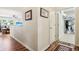 Hallway leads to a laundry room with views of the living space at 1468 Blackthorne N Trl, Plainfield, IN 46168