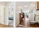 Hallway featuring wood floors and views into the bedroom and living room at 1468 Blackthorne N Trl, Plainfield, IN 46168