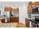 Kitchen features stainless steel appliances, granite countertops, ample cabinet space, and tiled backsplash at 1468 Blackthorne N Trl, Plainfield, IN 46168