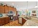 Well-appointed kitchen with modern appliances, granite counters, and wood floors at 1468 Blackthorne N Trl, Plainfield, IN 46168