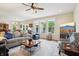 Spacious living room with a ceiling fan, wood floors, and natural lighting at 1468 Blackthorne N Trl, Plainfield, IN 46168