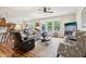 Spacious living room with a ceiling fan, wood floors, and natural lighting at 1468 Blackthorne N Trl, Plainfield, IN 46168