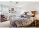 Spacious main bedroom featuring white walls, carpet, a wood frame bed, and neutral colored bedding at 1468 Blackthorne N Trl, Plainfield, IN 46168