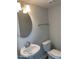 Half bathroom with sink, toilet, mirror, and towel rack at 17399 Dovehouse Ln, Westfield, IN 46074