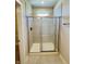 Shower with glass doors and tiled walls at 17399 Dovehouse Ln, Westfield, IN 46074