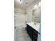 A clean bathroom featuring a vanity with a sink, mirror, toilet, and a shower-tub combo at 17399 Dovehouse Ln, Westfield, IN 46074
