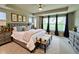 Main bedroom featuring tray ceiling, neutral walls, and carpeted floor at 17399 Dovehouse Ln, Westfield, IN 46074