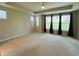 Carpeted bedroom with lots of natural light and neutral paint at 17399 Dovehouse Ln, Westfield, IN 46074