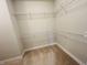 A walk-in closet featuring metal shelving providing ample storage space for clothes and accessories at 17399 Dovehouse Ln, Westfield, IN 46074