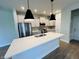 Modern kitchen features a large island, stainless steel appliances, shaker cabinets, and an open layout at 17399 Dovehouse Ln, Westfield, IN 46074