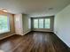 Bright and airy living room featuring hardwood floors and large windows offering great natural light at 17399 Dovehouse Ln, Westfield, IN 46074