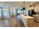 Open floorplan features a spacious kitchen, an eat-in island, and stainless steel appliances at 17399 Dovehouse Ln, Westfield, IN 46074