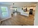 Bright open floorplan features a spacious kitchen, dining area, and a view of the foyer at 17399 Dovehouse Ln, Westfield, IN 46074