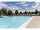 A sparkling community pool with lounge chairs offering a relaxing outdoor experience at 17399 Dovehouse Ln, Westfield, IN 46074