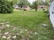 Large, grassy backyard, showcasing outdoor space and landscaping at 207 E Plum St, Anderson, IN 46012