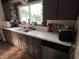 Functional kitchen featuring stainless steel appliances, updated cabinets, and laminate countertops at 207 E Plum St, Anderson, IN 46012