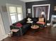 Welcoming living room with a comfortable sofa and large window allowing plenty of natural light at 207 E Plum St, Anderson, IN 46012