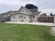 Spacious backyard featuring a well-maintained lawn and a concrete patio perfect for outdoor entertaining at 2208 S F St, Elwood, IN 46036