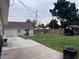 Expansive backyard featuring lush lawn, and a storage shed, with privacy fence at 2208 S F St, Elwood, IN 46036