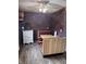 Cozy breakfast nook with a brick wall, booth seating, and modern laminate flooring at 2208 S F St, Elwood, IN 46036