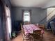 Cozy dining room featuring wood floors, table, and a vintage-style heater at 2208 S F St, Elwood, IN 46036