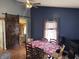Stylish dining room featuring blue walls, wood floors, and a dining table at 2208 S F St, Elwood, IN 46036