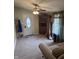 Welcoming entryway featuring a front door, carpet, and coat rack for your convenience at 2208 S F St, Elwood, IN 46036