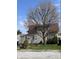 Charming two-story home with mature tree offering shade and curb appeal at 2208 S F St, Elwood, IN 46036
