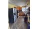 Functional kitchen with stainless steel appliances, wood cabinetry, and plenty of counter space at 2208 S F St, Elwood, IN 46036