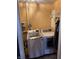 Laundry area with a front-load washing machine, a dryer, and orange painted walls at 2208 S F St, Elwood, IN 46036