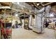 Spacious unfinished basement with visible ductwork, shelves, and ample storage space at 236 W 33Rd St, Indianapolis, IN 46208