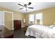 Serene bedroom with warm natural light, ample closet space, and comfortable furnishings at 236 W 33Rd St, Indianapolis, IN 46208