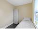 Neutral bedroom featuring wardrobe, single bed, and window providing natural light at 236 W 33Rd St, Indianapolis, IN 46208