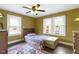 Comfortable bedroom features wooden floors, natural light, and stylish decor throughout at 236 W 33Rd St, Indianapolis, IN 46208