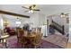 Elegant dining room with a wooden table, chairs, and hardwood floors, open to the living room at 236 W 33Rd St, Indianapolis, IN 46208