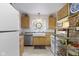 Bright kitchen featuring granite countertops, stainless appliances, and a convenient pantry at 236 W 33Rd St, Indianapolis, IN 46208