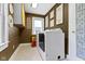 A warm laundry room with decoratives walls and floors, including a front-load washer and dryer at 236 W 33Rd St, Indianapolis, IN 46208
