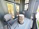 Cozy balcony area with a small barrel table and chairs, creating an inviting outdoor space at 247 Poplar St, Westfield, IN 46074