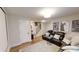 Basement with movie posters, a lounge area, and access to the upper floors at 247 Poplar St, Westfield, IN 46074